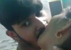 School students kissing parents outside