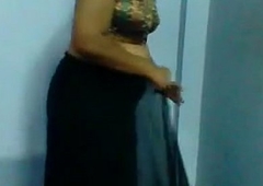 Mature Indian Woman Getting Dressed