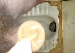 Masturbate using condom in dirty public toilet