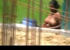 Desi woman caught bathing outdoors