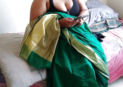 Telugu aunty in green saree with Huge Boobs on bed and fucks neighbor while watching porn on mobile - Huge cumshot