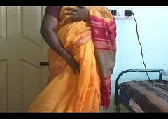 desi  indian horny tamil telugu kannada malayalam hindi cheating wife vanitha wearing orange colour saree  showing big boobs and shaved pussy fluster hard boobs fluster nip rubbing pussy wrong